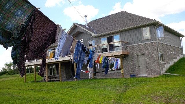 Cathy says it really feels like home now that there is a clothes line strung from the back of it.